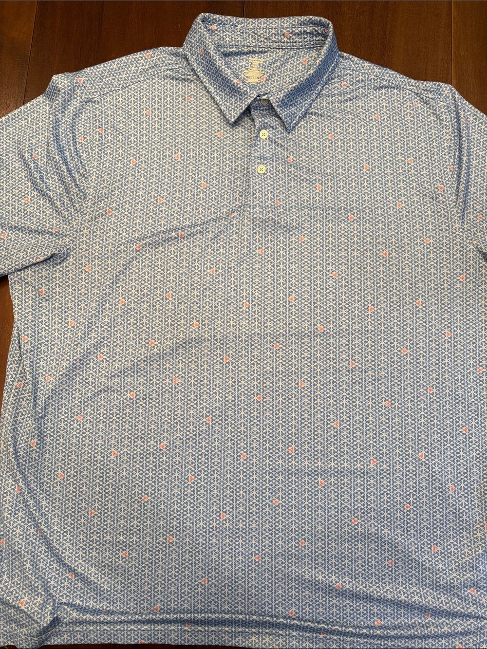 Light Blue Short-Sleeve Polo with Subtle Coral Dot Detail